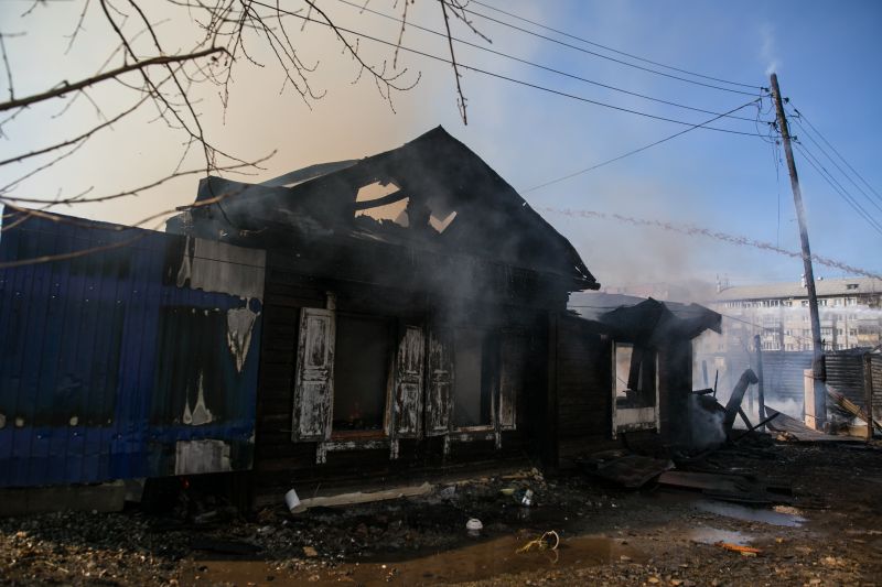 Restoration Technician Inspecting Damage